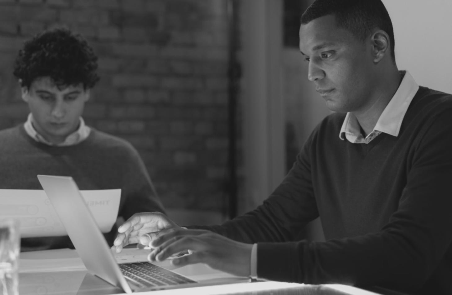 Close-up view of investment tracking spreadsheet with monthly contribution data